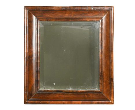 A walnut cushion framed mirror, 18th century, the bevelled plate within a moulded frame52 x 47cmThe moulding around the mirro