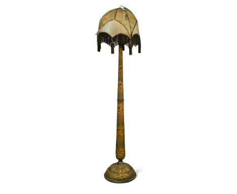 An Indian Kashmiri decorated wood standard lamp, early 20th century, the damaged parchment shade on a tapering column raised 