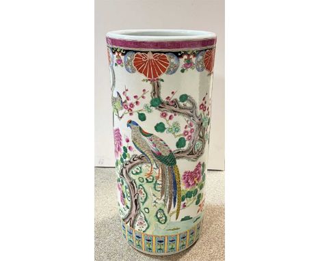 A Chinese famille rose porcelain cylindrical stick stand,  painted with exotic birds amongst peonies, six character mark of K