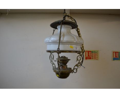 A converted ceiling light with milk glass shade 