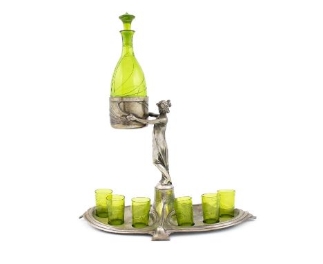By WMF, a German Art Nouveau electroplated liqueur set,on a shaped base on four bracket feet, with six reservoirs for green g