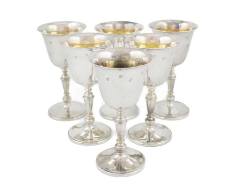 A set of six modern silver goblets,by Camelot Silver Ltd, London 1994,circular tapering forms, knopped baluster stems, gilded