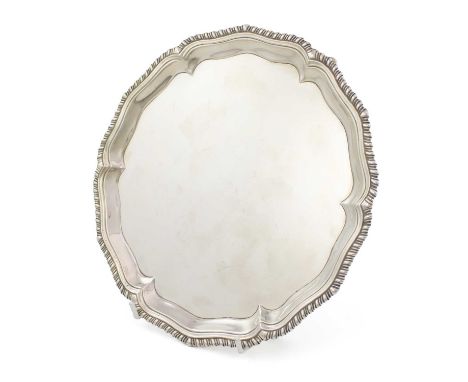 A George III silver waiter,maker's mark probably that of John Carter, London 1769,circular form with a gadrooned border, on t