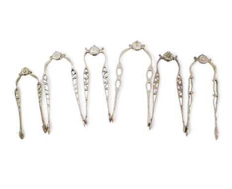 A collection of six pairs of antique and modern cast silver sprung sugar tongs, various dates and makers, with a central pivo