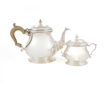 A matched modern silver teapot and sugar bowl,by C J Vander Ltd, London 1963 and 1967,plain circular bellied form, scroll han