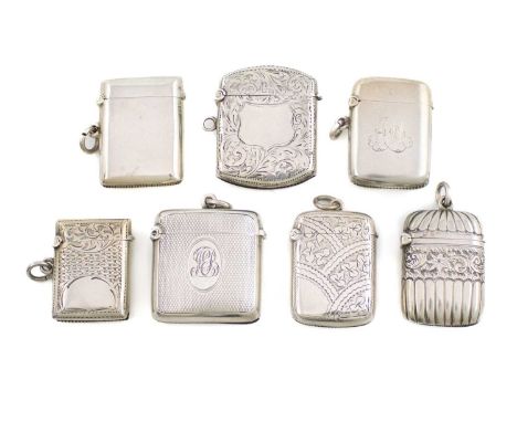 A collection of seven silver vesta cases, various dates and makers, comprising: one with fluted decoration, three with engrav