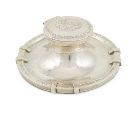 By Omar Ramsden, an Arts and Crafts silver inkwell,  engraved 'Omar Ramsden Me Fct.', London 1923, circular form, spot-hammer
