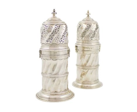 A pair of Edwardian silver sugar casters, by George Nathan & Ridley Hayes, Chester 1905, lighthouse form with swirl-fluted de