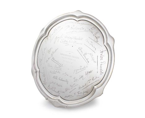 A silver presentation salver,by Atkin Brothers, Sheffield 1926,shaped circular form with a moulded border, inscribed 'Present