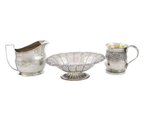 A George III silver mug,by Emes and Barnard, London 1814,baluster form, bifurcated scroll handle, chased vine border, initial