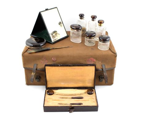 λ A silver-gilt mounted and tortoiseshell travelling dressing table set,by Mappin and Webb, London 1927,comprising: a spirit 