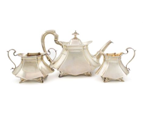 λ A matched Edwardian silver three-piece tea service, by Elkington & Co. Ltd, Birmingham 1904 and 1905, shaped rectangular fo
