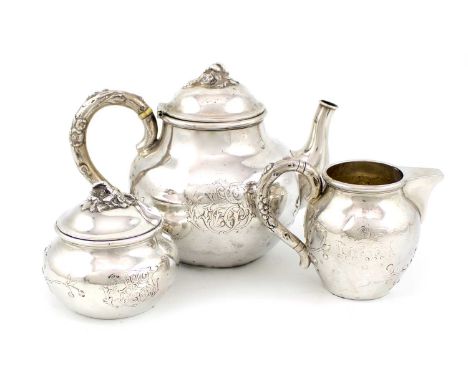 λ A late-19th century German silver three-piece tea set, by Körner & Proll, Berlin circa 1890, bulbous circular form, embosse