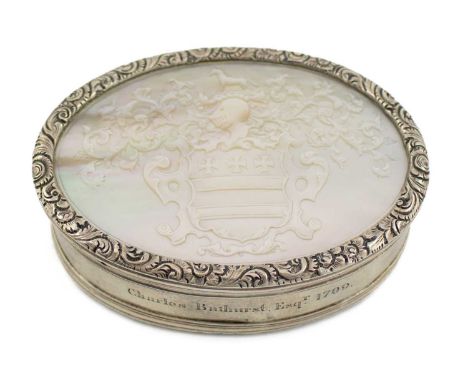 A 19th century silver and mother-of-pearl snuff/tobacco box, unmarked, oval form, the pull-off cover with a foliate border an