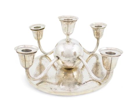 An Austrian silver five-light candelabrum,Stamped ENTW. Prof Otto Prutscher, OESTERREICHER, Vienna,with a central spot-hammer