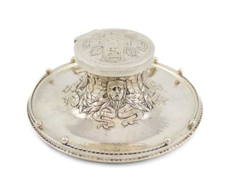 By Omar Ramsden and Alwyn Carr, an Arts and Crafts silver inkwell, London 1917, raised circular form with rope-work and spher