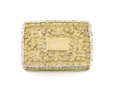A George IV silver-gilt vinaigrette,by John Bettridge, Birmingham 1827,rectangular form, the cover and base with scroll folia