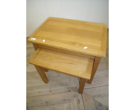 Nest of two light oak rectangular occasional tables 