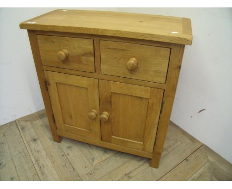 Modern light oak cabinet with two drawers above two panelled cupboard doors (75cm x 34cm x 80cm) 