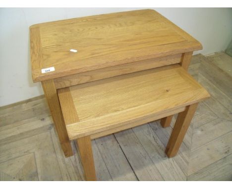Nest of two light oak rectangular occasional tables 