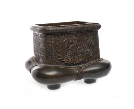 20TH CENTURY CHINESE BRONZE OPEN CENSERwith dragon designs, with unusual lower section, on four feet, mark to base, the mouth
