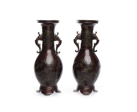 PAIR OF JAPANESE TWO HANDLED BRONZE VASES with cast animal handles, decorated with images of birds and flowers, 34 cm tall