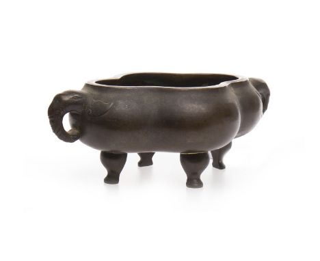 20TH CENTURY CHINESE BRONZE CENSER of lobed oval form, with elephant lug handles, on four feet, mark to base, 24cm wide 