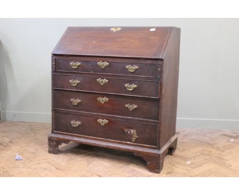 An early 19th Century mahogany bureau on bracket feet, original hardware, width 38", depth 20", height 43"