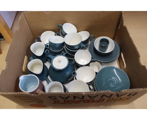 A large selection of Poole pottery tea wares, teapot, jugs, cups and saucers