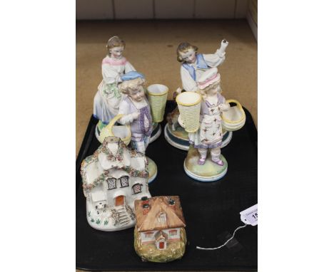 A pair of late 19th Century continental porcelain figures, part bisque part glazed children with animals, a pair of children 