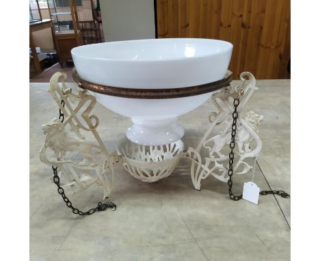 A vintage framed hanging lamp with glass shade, the frame decorated with lions