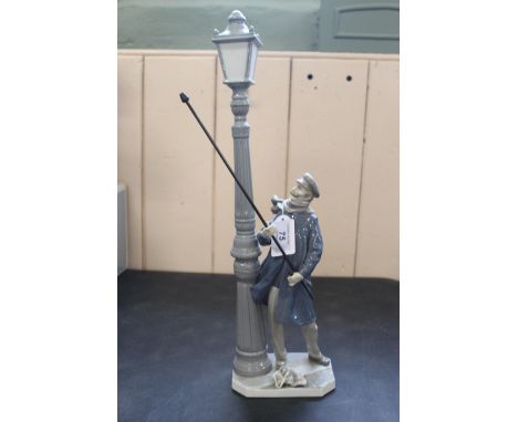 A boxed and signed by a member of the Lladro family, a figurine 'The Lamp Lighter', signed and dated to base 14-3-87, 18 1/2"