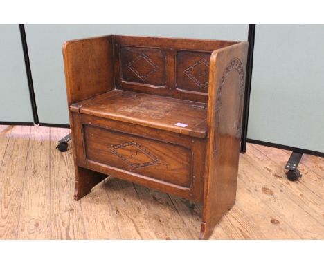 A 1930's diminutive oak monk's bench