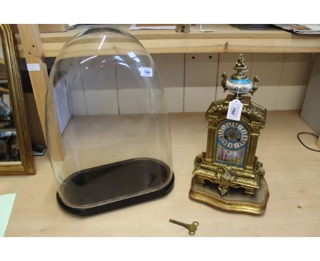 An ornate 19th Century gilded French mantle clock under glass dome, the movement marked Hy (Henry) Mark, Paris, the body deco