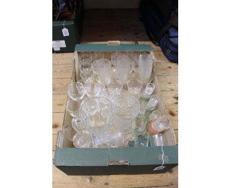 A selection of vintage drinking glasses, including champagne saucers, glass jug and vase