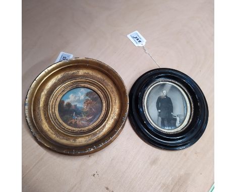 A 19th Century small circular oil on oak panel of a mother and child in a landscape in original gilt circular frame and an ov