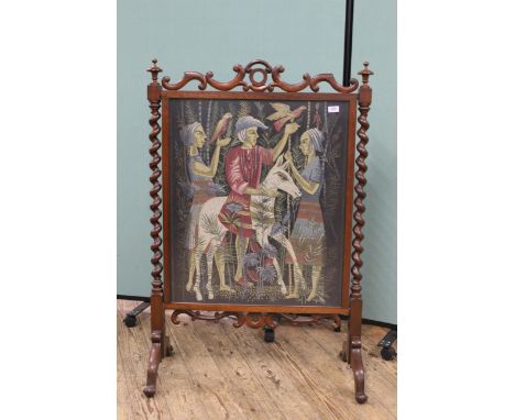 A large early Victorian rosewood framed fire screen with decorative tapestry panel of figures with birds