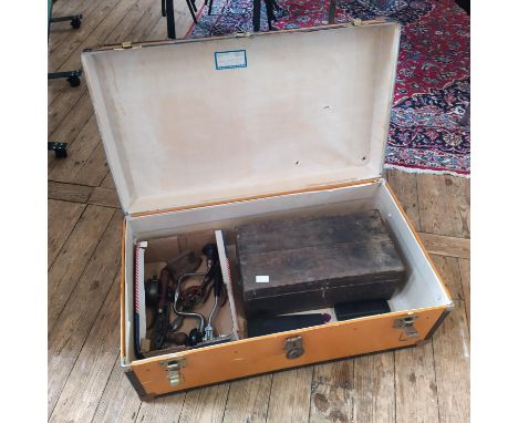 A vintage travelling trunk with contents 