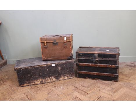 An Edwardian pine travelling trunk and two vintage canvas trunks