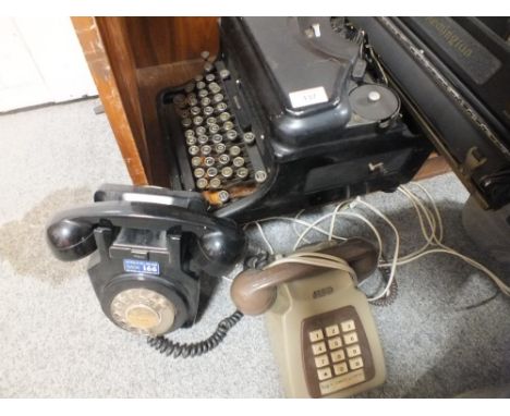 A VINTAGE REMINGTON TYPEWRITER TOGETHER WITH TWO VINTAGE TELEPHONES