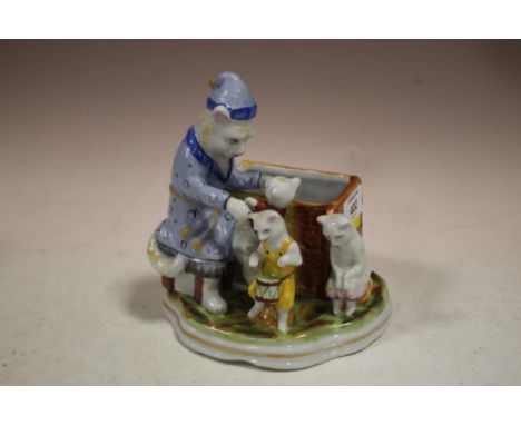 A CAT AND KITTEN CERAMIC FIGURE 