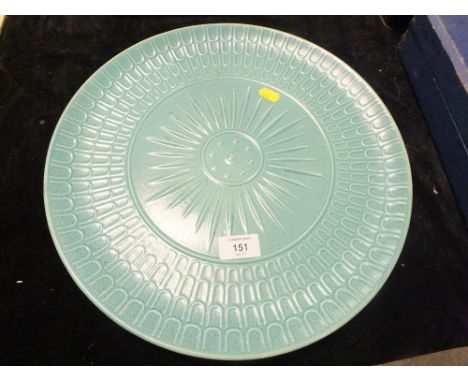 A VINTAGE GREEN CERAMIC CHARGER