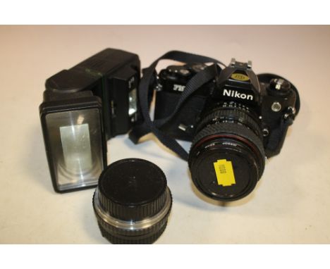 A NIKON CAMERA AND FLASH, LENS ETC. 