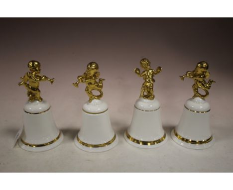 FOUR ROYAL DOULTON LIMITED EDITION 'THE SPEECH OF ANGELS' CERAMIC BELLS, each white bone china bell surmount with a gilt cher