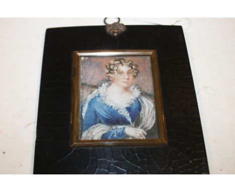 A LATE 19TH / EARLY 20TH CENTURY PORTRAIT MINIATURE STUDY OF A YOUNG LADY IN A BLUE DRESS, unsigned, framed and glazed, 8 x 6