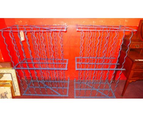 A pair of vintage blue painted wrought iron wine racks 