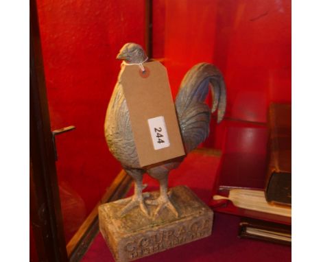 A vintage spelter Courage brewers advertising figure, in the form of a chicken on a rectangular section base 