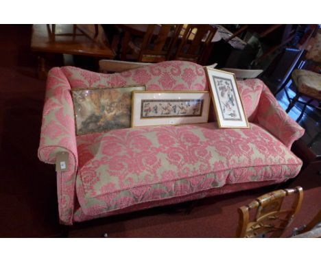 A Georgian mahogany hump back sofa upholstered in designers guild ombrione peony fabric, having scrolling arms and raised on 