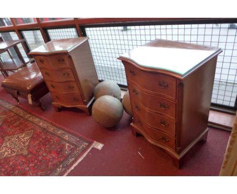 A pair of Georgian style walnut serpentine fronted four drawer bedside chests with brass handles on bracket feet