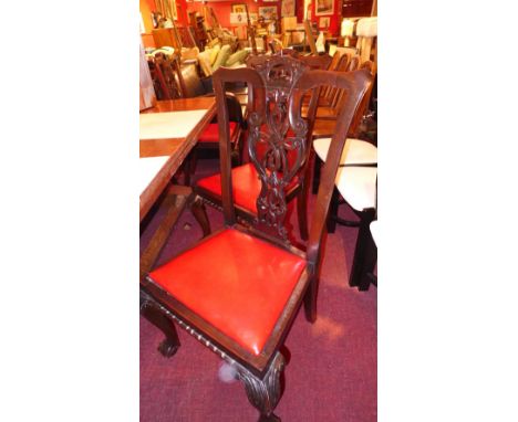 A set of six Chippendale style mahogany dining chairs with drop in seats and raised on ball and claw supports 